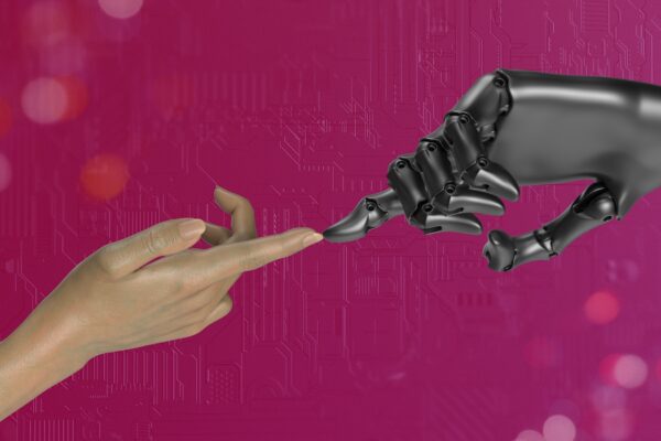 What Is Artificial Intelligence (AI)? A Comprehensive Guide two hands touching each other in front of a pink background
